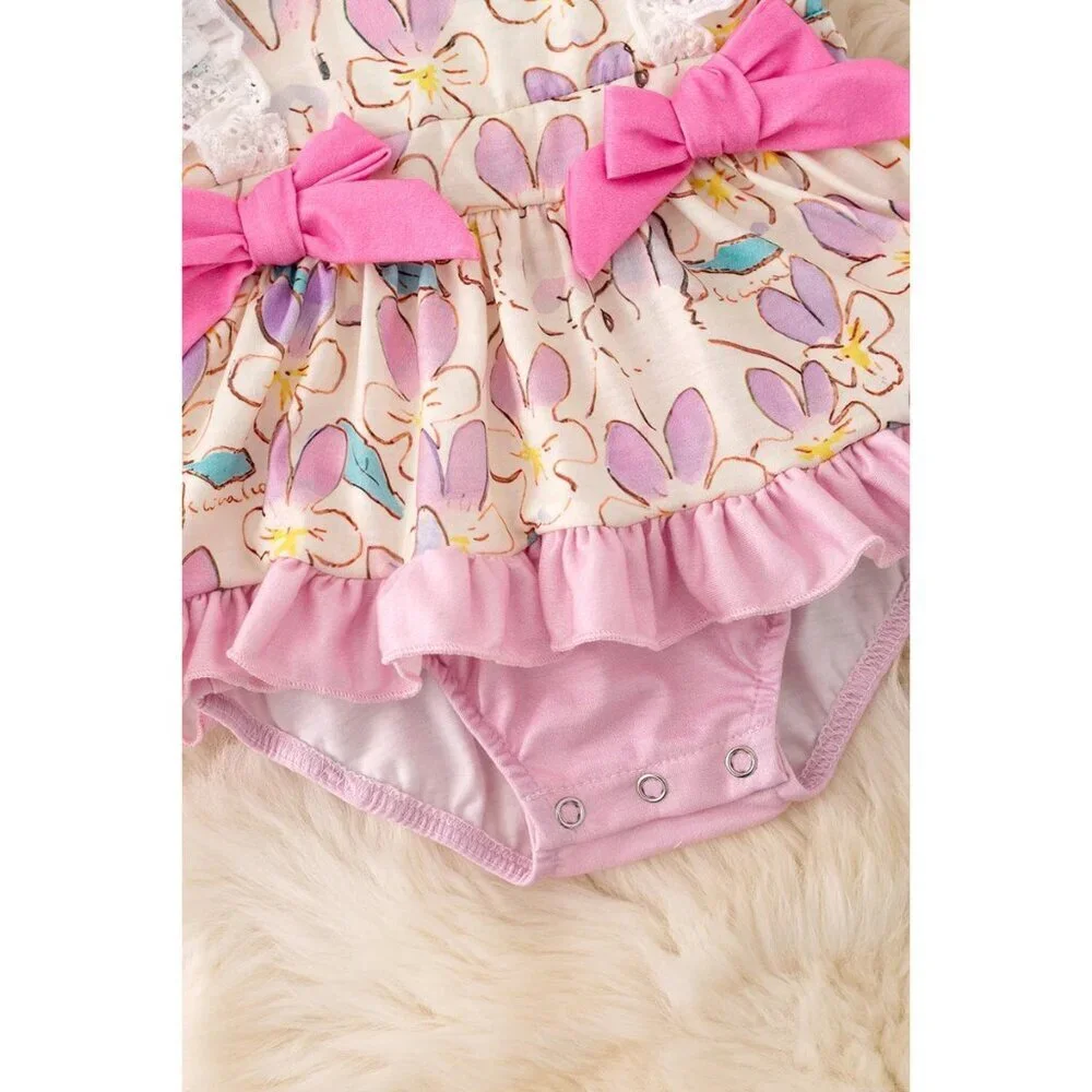 Lilac, blue & fuchsia twirl onesie with side bows. RPG50210 SOL